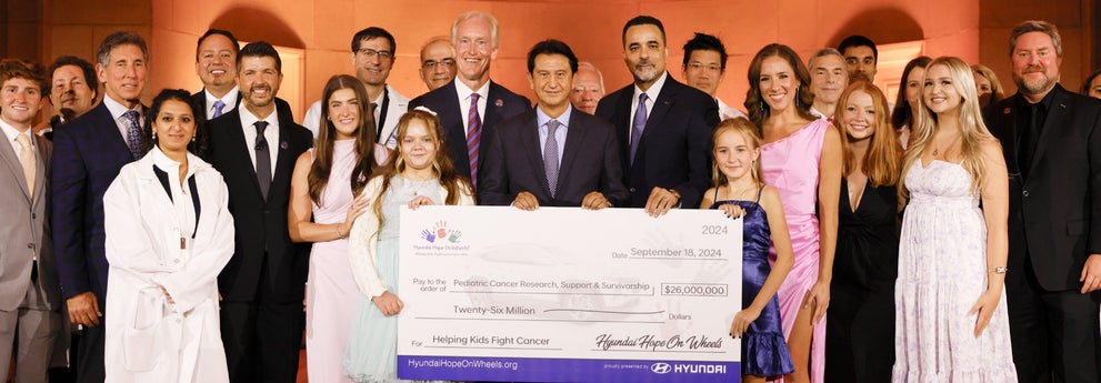 helping kids fight cancer foundation showing their big check from hyundai hope on wheels - Winner Hyundai in Dover DE